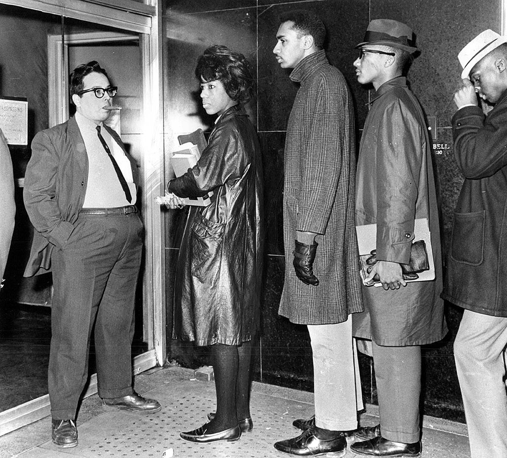 African-Americans being refused entry to a theater in 1963