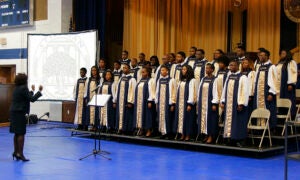 Stillman College choir in robes sing onstage