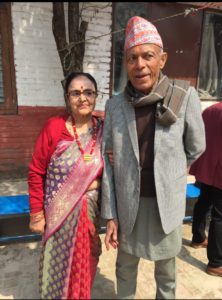 elderly man and woman stand side-by-side in Nepal