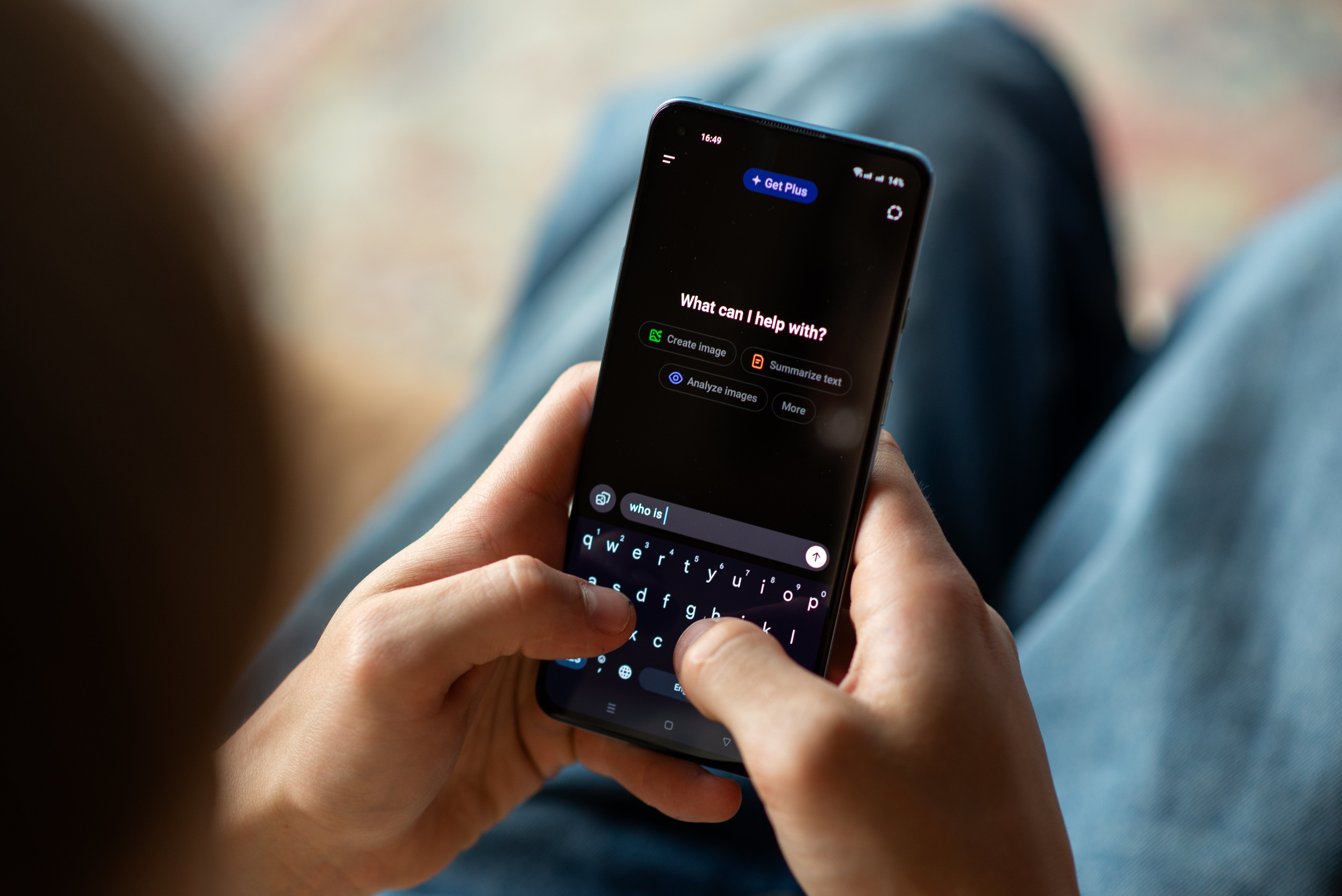 A person uses a smartphone to interact with an AI assistant.
