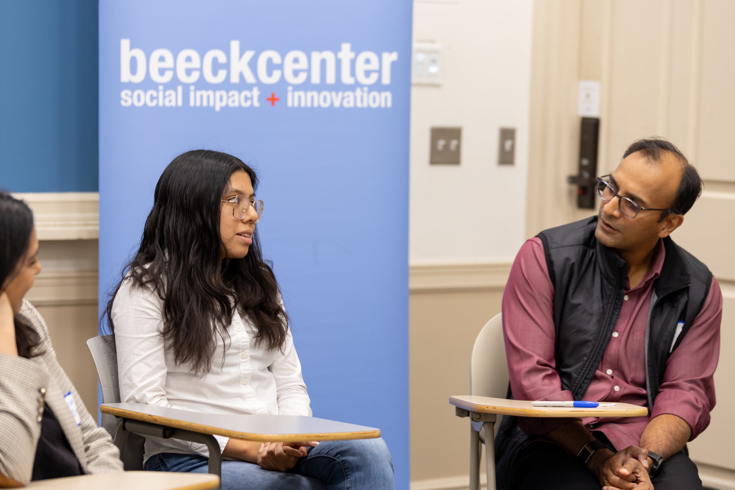 Alessandra Garcia Guevara speaks with guest speakers DJ Patil, former Chief Data Scientist of the U.S. Office of Science and Technology Policy (right), and Lisa Singh, the chair of the Department of Computer Science and director of the Massive Data Institute in the McCourt School of Public Policy at Georgetown University (left) at Civic Tech Live 2025, an event hosted by the Beeck Center for Social Impact + Innovation.