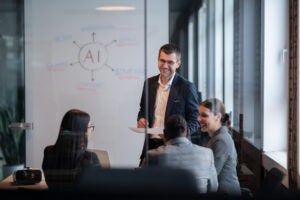 Group of people discussing AI and smiling